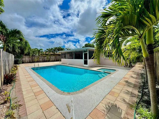 a view of a swimming pool with a lounge chairs