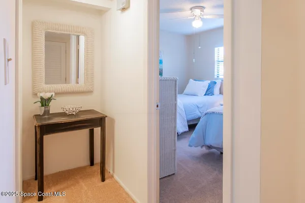 a view of a livingroom from a hallway