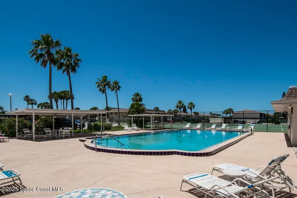 a view of a swimming pool with a patio