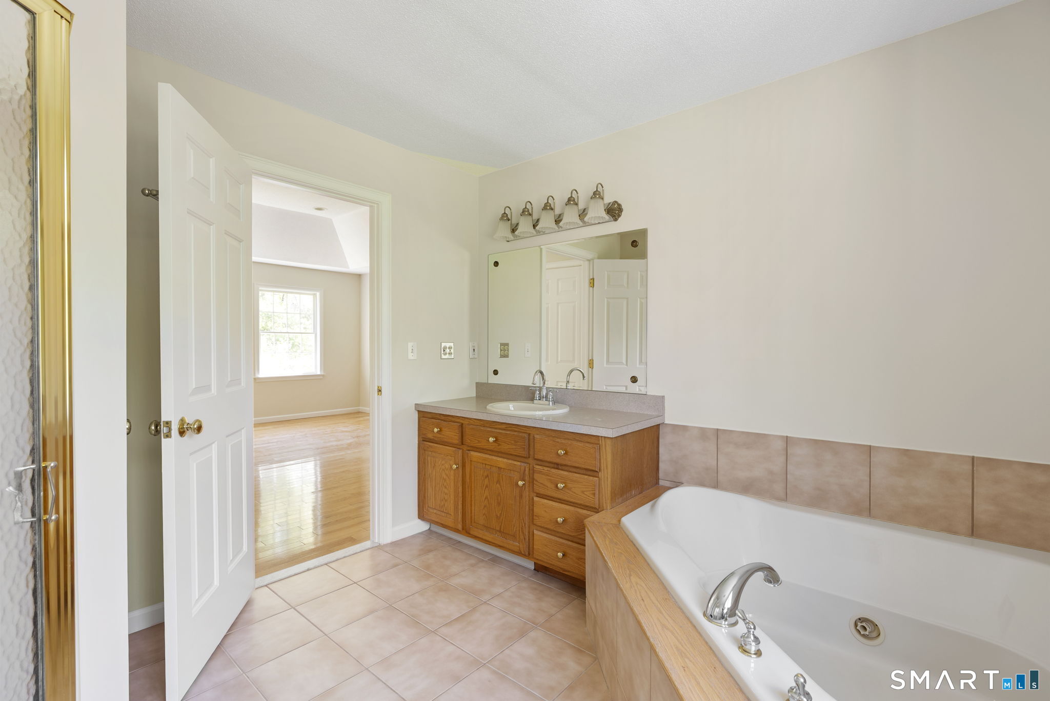 555 Waterville Road Avon, CT 06001 - Photo 33 of 40 a bathroom with a tub sink and mirror