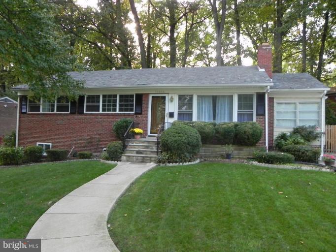 10506 Royal Road Silver Spring, MD 20903 - Photo 1 of 11 a view of a house with a backyard and a garden