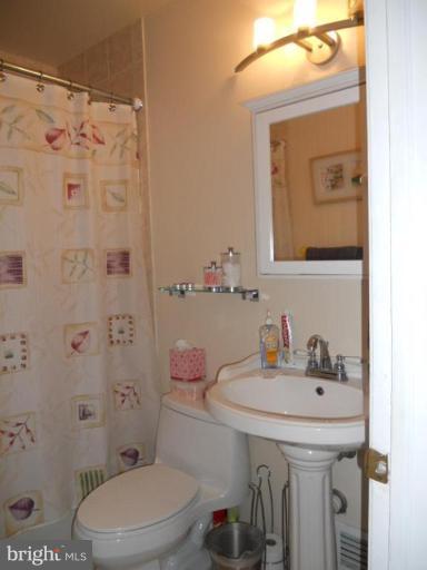 10506 Royal Road Silver Spring, MD 20903 - Photo 4 of 11 a bathroom with a sink a toilet and shower