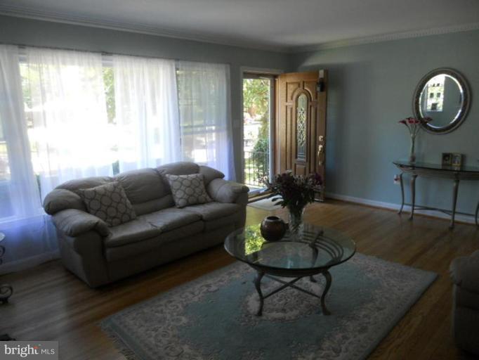 10506 Royal Road Silver Spring, MD 20903 - Photo 9 of 11 a living room with furniture a window and a table