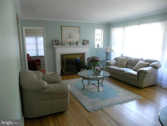 10506 Royal Road Silver Spring, MD 20903 - Photo 10 of 11 a living room with furniture and a fireplace