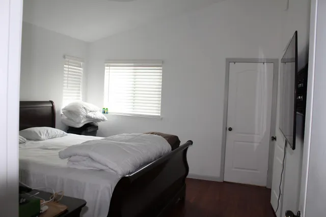 a living room with a bed and furniture