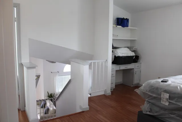 a bathroom with a sink vanity and mirror