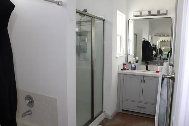 a view of a room with furniture and wooden floor