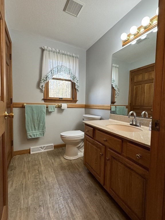 400 N Road Westfield, MA 01085 - Photo 15 of 27 a spacious bathroom with a double vanity sink a toilet and a mirror