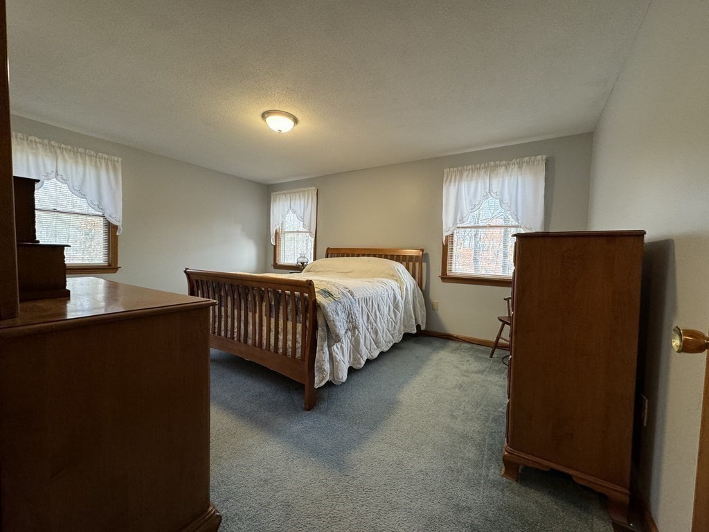 400 N Road Westfield, MA 01085 - Photo 21 of 27 a bedroom with a bed and a dresser