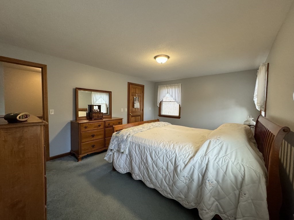 400 N Road Westfield, MA 01085 - Photo 22 of 27 a bedroom with a bed and a view of kitchen