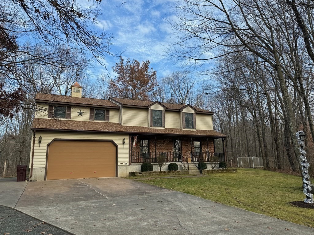 400 N Road Westfield, MA 01085 - Photo 3 of 27 a front view of a house with garden