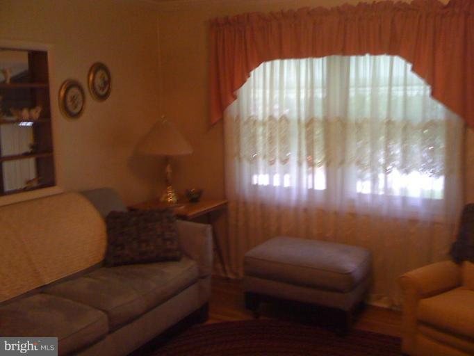 12327 Middle Road Silver Spring, MD 20906 - Photo 4 of 15 a living room with furniture and a window