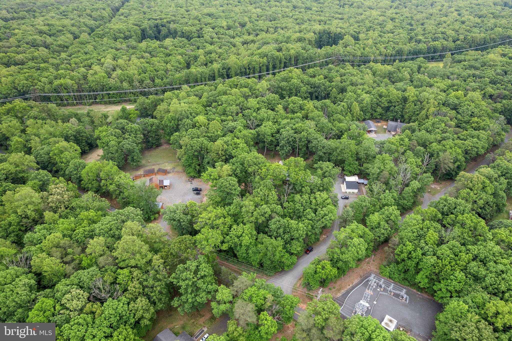 5099 Courtneys Corner Road Sumerduck, VA 22742 - Photo 45 of 52 an aerial view of residential house with outdoor space and trees all around