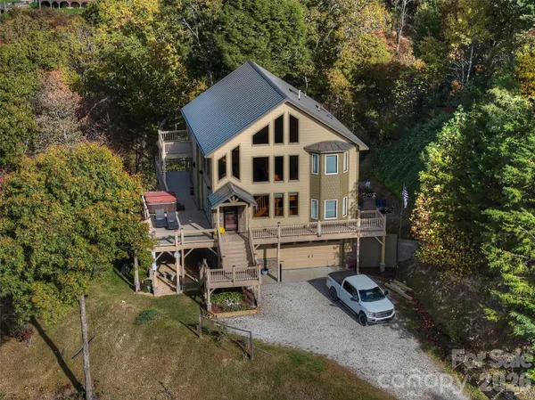 a view of a house with backyard sitting area and garden