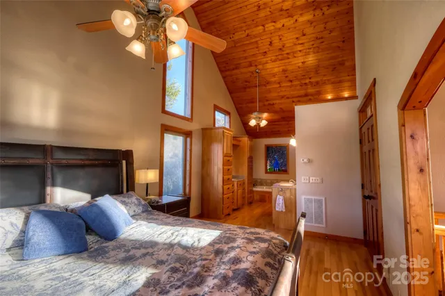 a bathroom with a granite countertop sink a mirror and a bathtub