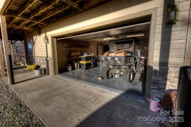 a view of a chairs and fire pit in the backyard