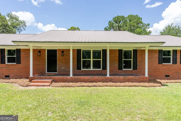 front view of a house with a yard