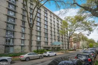 a view of street with parked cars