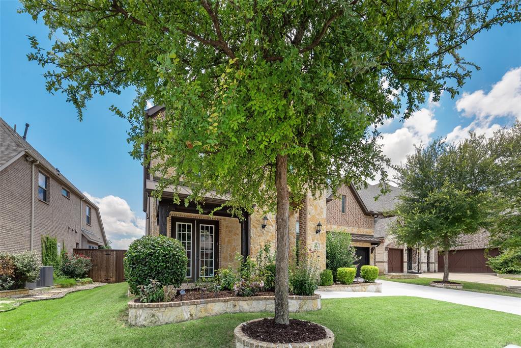 2021 Calisto Way Allen, TX 75013 - Photo 5 of 34 Stone and brick facade residence with dark trim accents