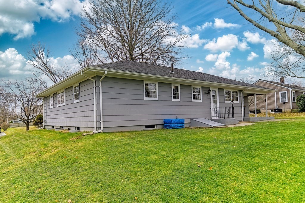 274 Kaufman Road Somerset, MA 02726 - Photo 3 of 13 a view of a house with a yard