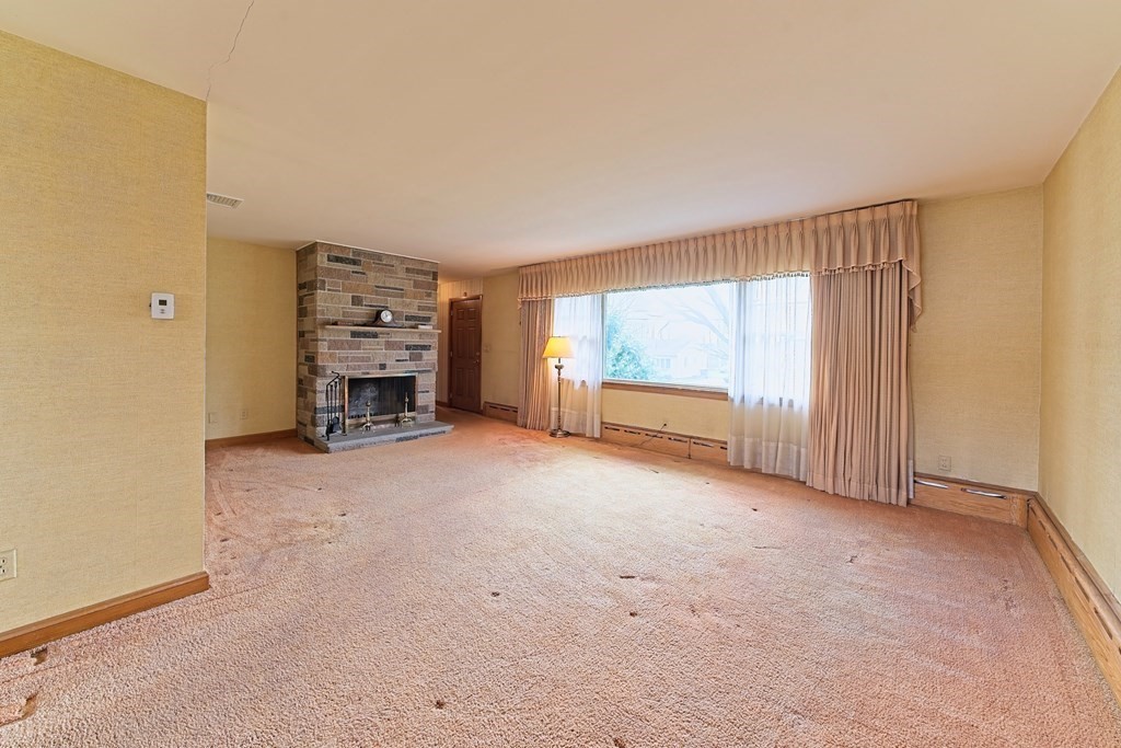 274 Kaufman Road Somerset, MA 02726 - Photo 4 of 13 a view of an empty room with a window