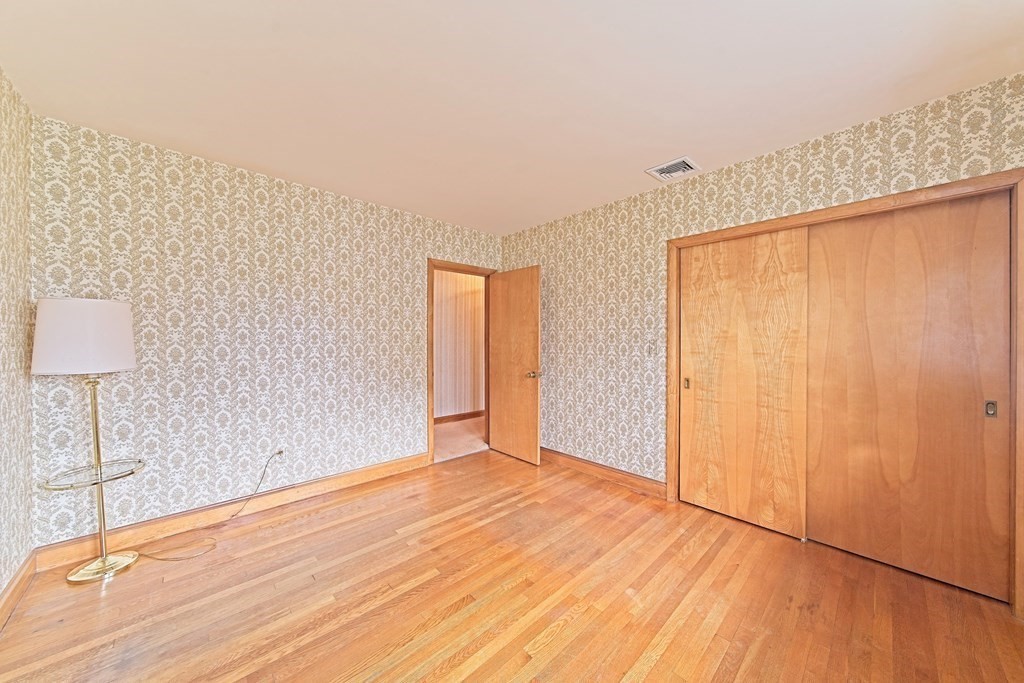 274 Kaufman Road Somerset, MA 02726 - Photo 10 of 13 a view of an empty room with wooden floor