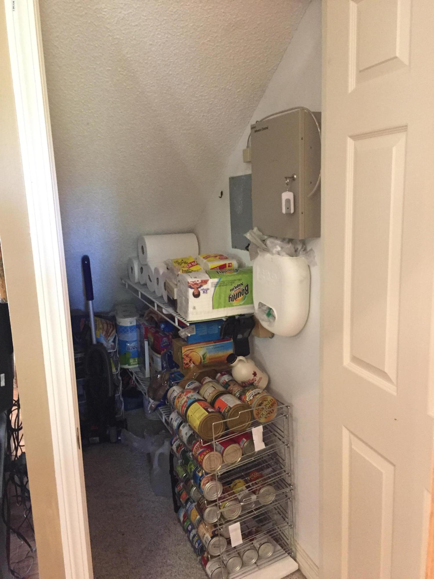 14766 Jim Byrd Road Biloxi, MS 39532 - Photo 30 of 61 stairwell pantry