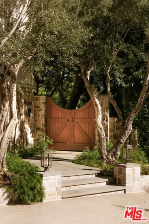 a outdoor living space with furniture and a fireplace