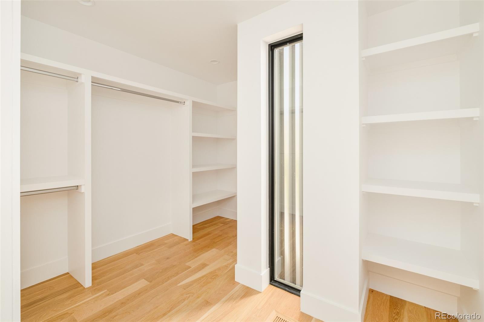 3554 Osage Street Denver, CO 80211 - Photo 19 of 40 a view of a bedroom from a hallway