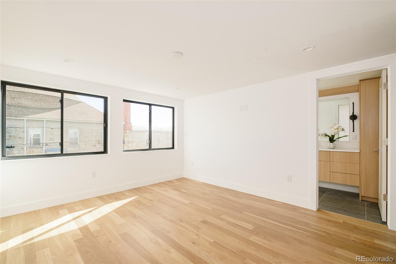 3554 Osage Street Denver, CO 80211 - Photo 22 of 40 a view of an empty room with a window