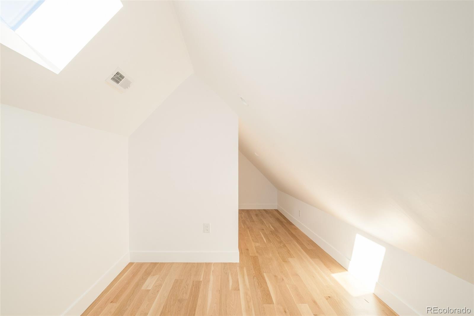3554 Osage Street Denver, CO 80211 - Photo 25 of 40 a view of a room with wooden floor and white walls