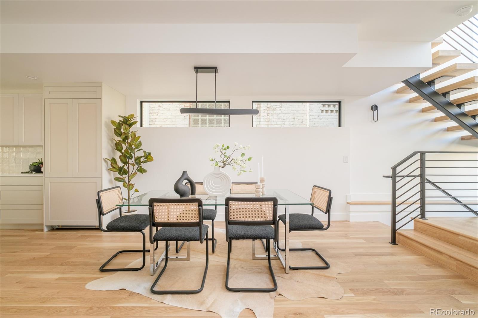 3554 Osage Street Denver, CO 80211 - Photo 5 of 40 a view of a dining room with furniture and wooden floor