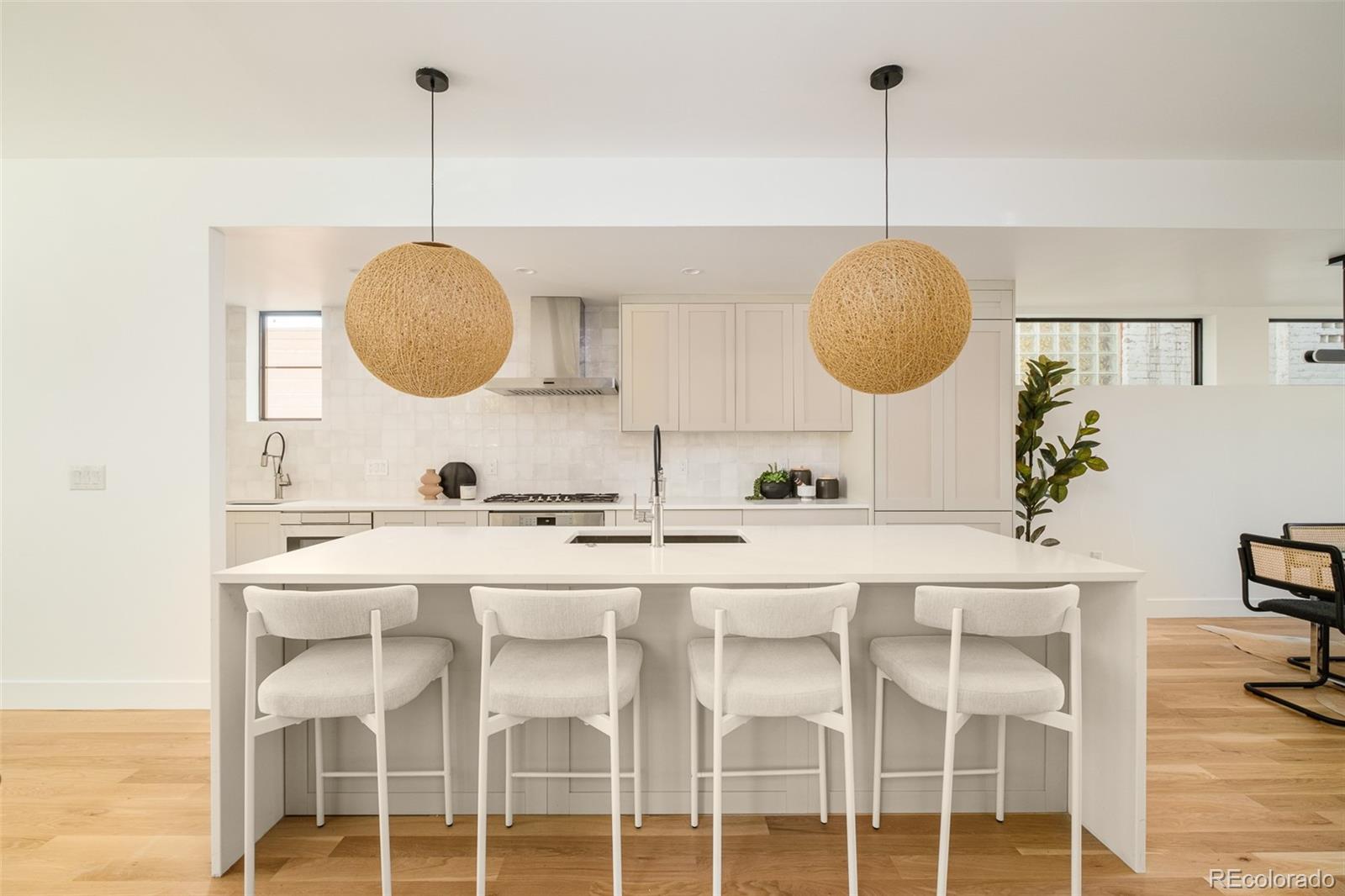 3554 Osage Street Denver, CO 80211 - Photo 8 of 40 a kitchen with a sink and cabinets