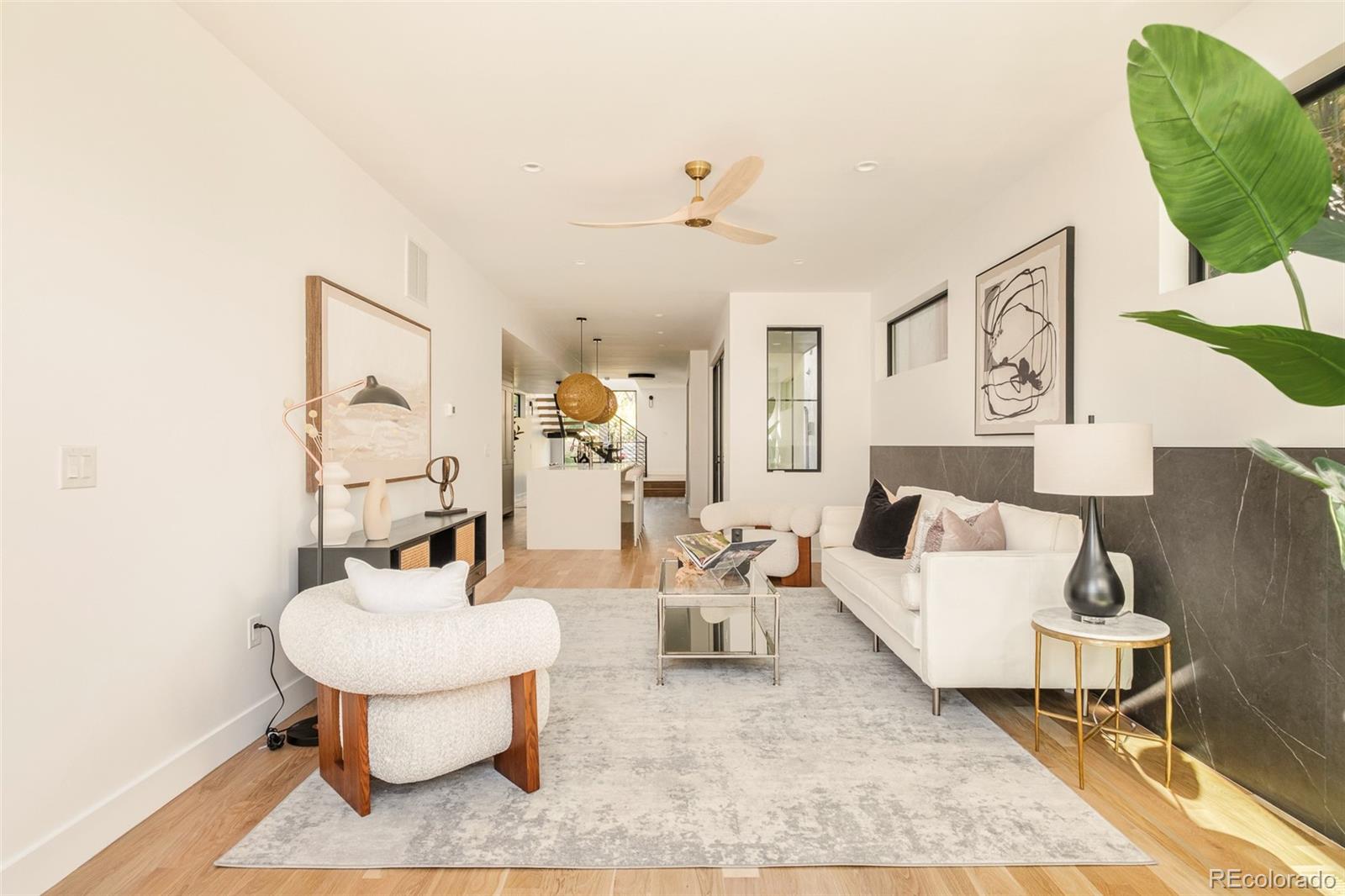 3554 Osage Street Denver, CO 80211 - Photo 10 of 40 a living room with furniture and a table