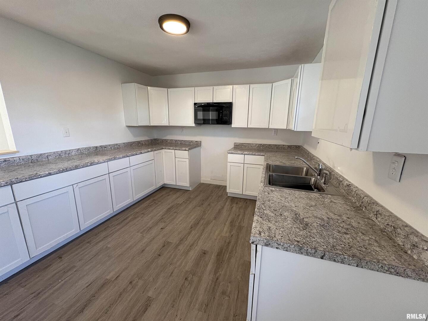 3305 Selmaville Road Salem, IL 62881 - Photo 4 of 17 a kitchen with stainless steel appliances granite countertop a sink a stove top oven a counter space and cabinets