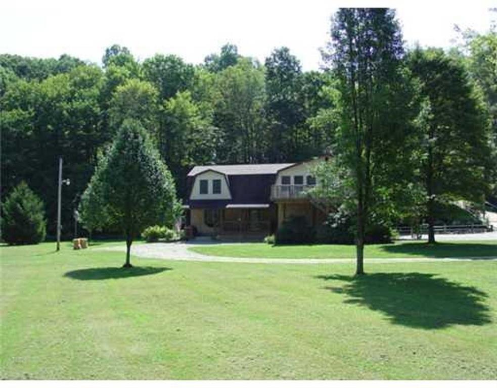 345 Duck Hollow Road Uniontown, PA 15401 - Photo 1 of 25 a house with lots of trees in the background