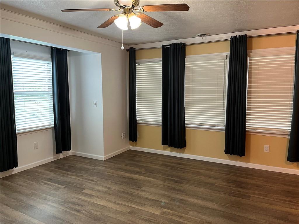 345 Duck Hollow Road Uniontown, PA 15401 - Photo 3 of 25 an empty room with wooden floor and windows