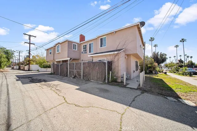 a view of a street with a building in the background