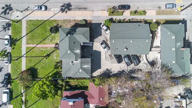 an aerial view of a house with a yard