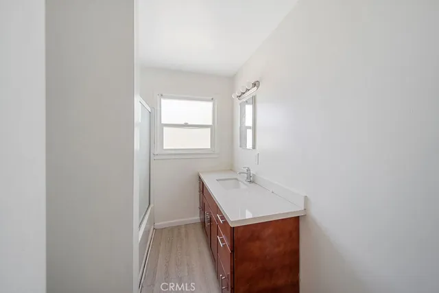 a bathroom with a sink a vanity and a mirror