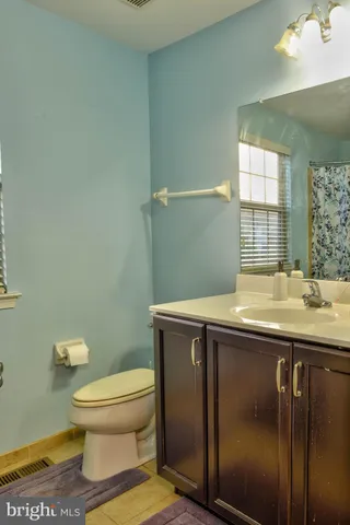 a bathroom with a tub and sink