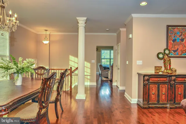a view of a room with furniture and wooden floor