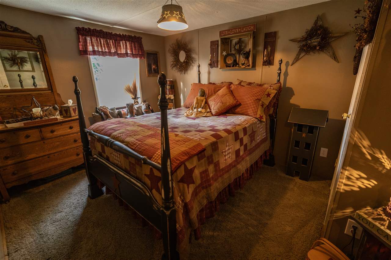 1365 George Walton Road Mount Solon, VA 22843 - Photo 17 of 28 a bed sitting in a bedroom next to a window