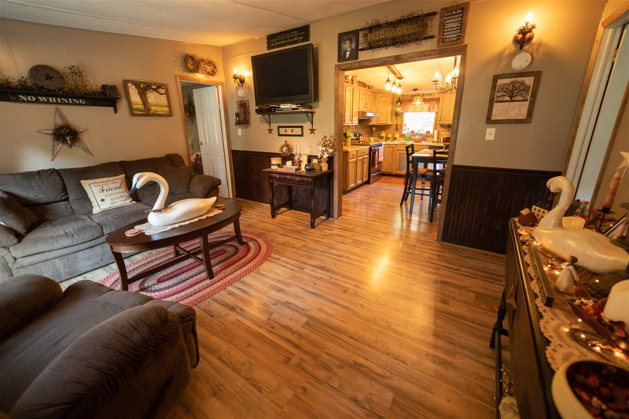 1365 George Walton Road Mount Solon, VA 22843 - Photo 5 of 28 a living room with furniture and a flat screen tv with wooden floor