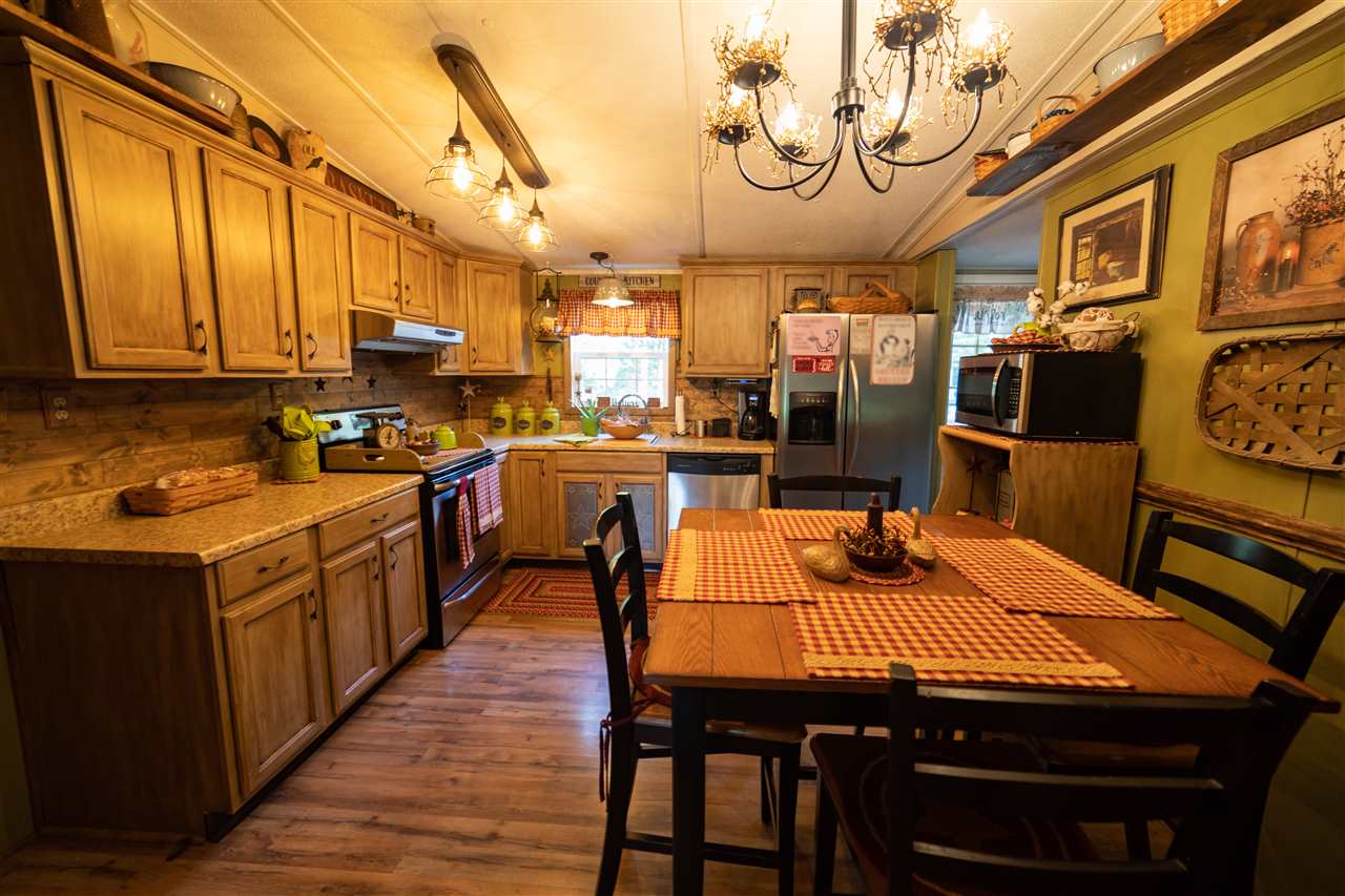 1365 George Walton Road Mount Solon, VA 22843 - Photo 7 of 28 a kitchen with stainless steel appliances granite countertop a stove a sink dishwasher and cabinets with wooden floor