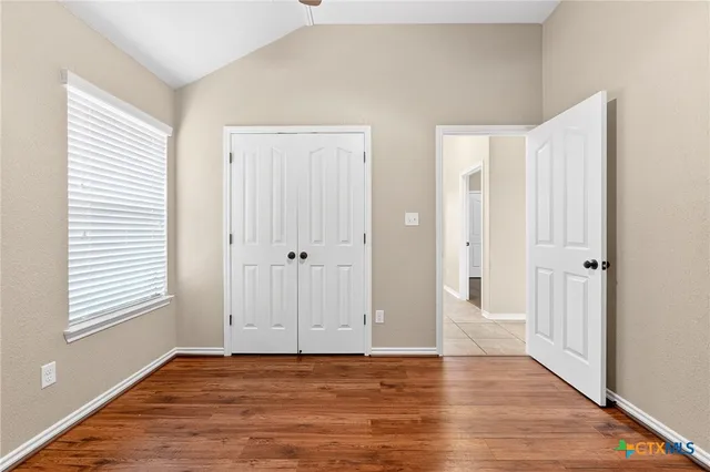 a kitchen with stainless steel appliances granite countertop a stove a sink a microwave oven and a refrigerator