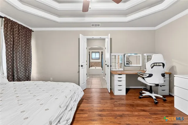 a en suite bathroom with a sink and a bathtub