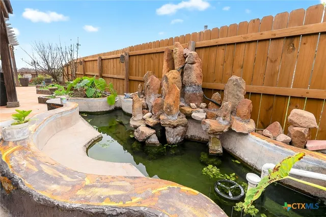 a view of a swimming pool with back yard