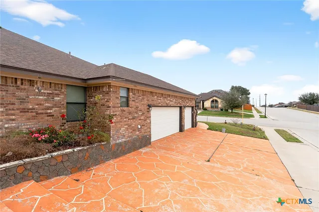 a view of backyard with a garden and entertaining space