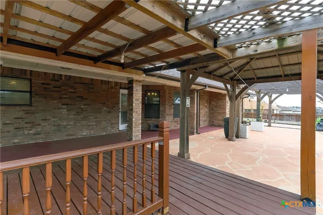 a view of a porch with wooden floor
